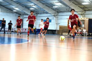 youth soccer players playing a game in goshen soccer academy