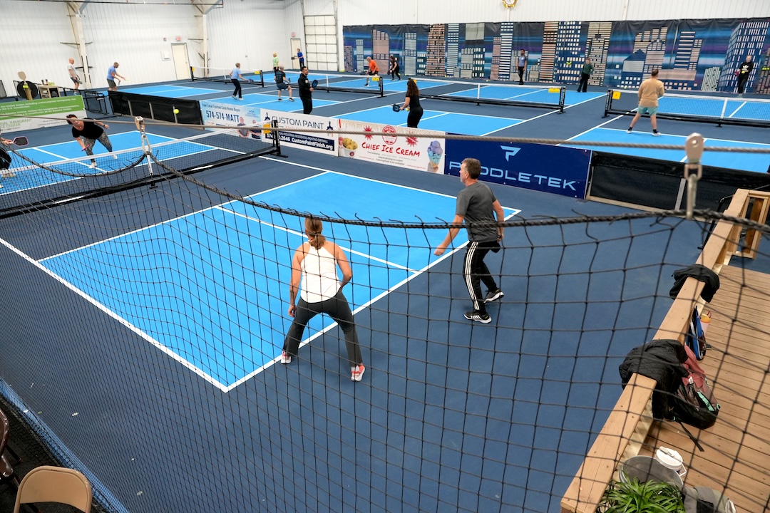 pickleball-in-goshen-indiana competitive pickleball players playing a game of pickleball inside a sports complex in goshen indiana